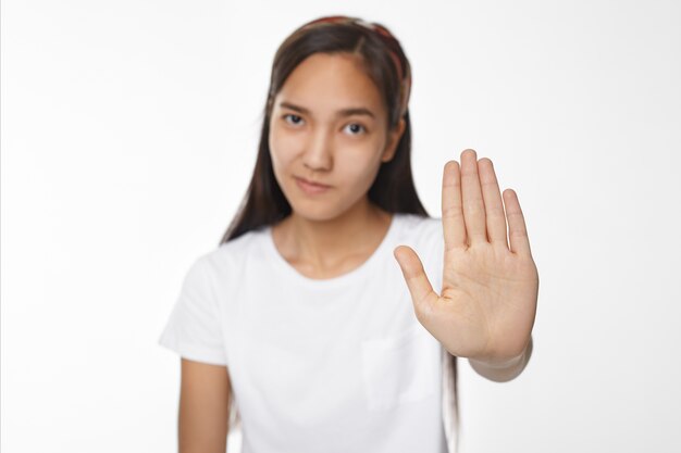 Expressive Asian girl posing indoor