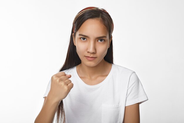 Expressive Asian girl posing indoor