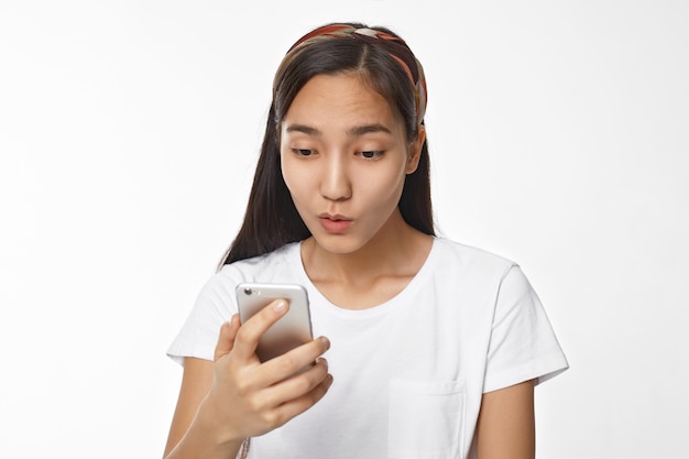 Expressive Asian girl posing indoor