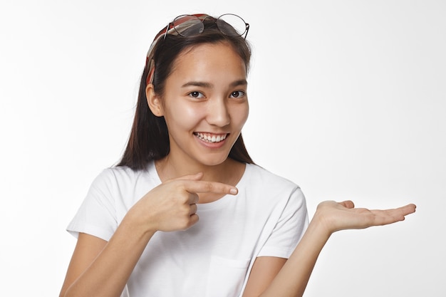 Expressive Asian girl posing indoor