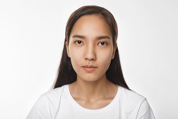 Expressive Asian girl posing indoor