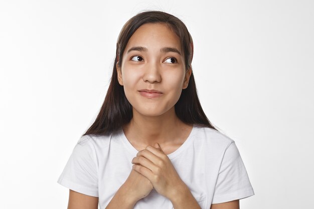 Expressive Asian girl posing indoor