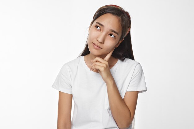 Expressive Asian girl posing indoor