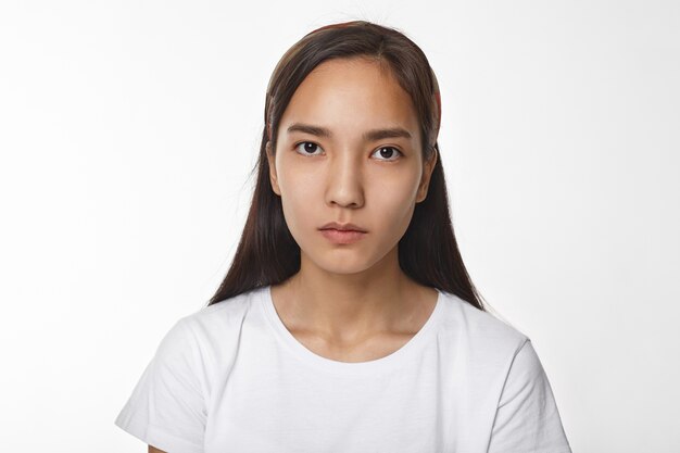 Expressive Asian girl posing indoor