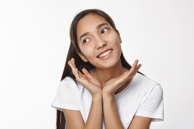 Expressive Asian girl posing indoor