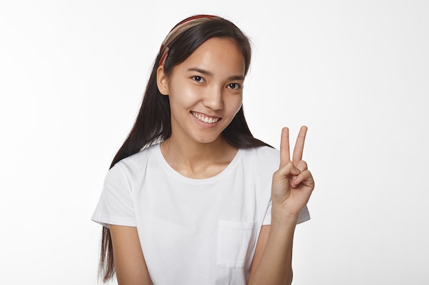 Expressive Asian girl posing indoor