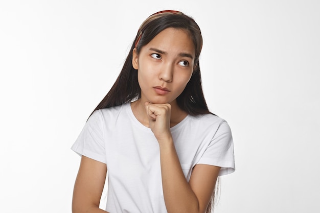 Expressive Asian girl posing indoor