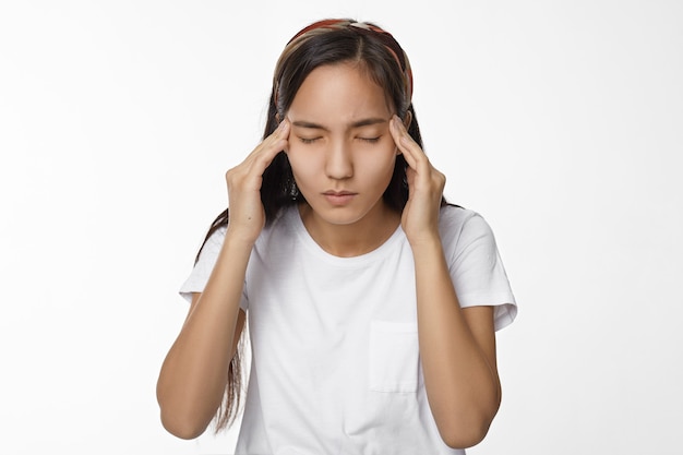 Expressive Asian girl posing indoor