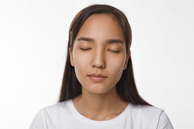 Expressive Asian girl posing indoor