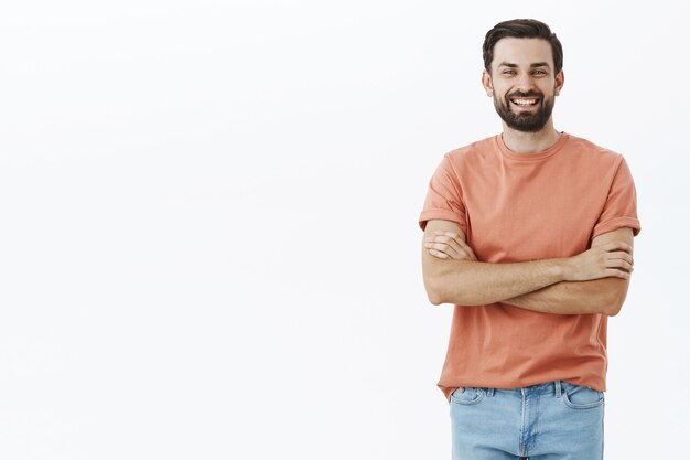 Expressive bearded man in orange Tshirt