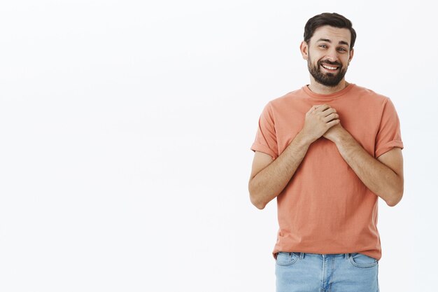 Expressive bearded man in orange Tshirt