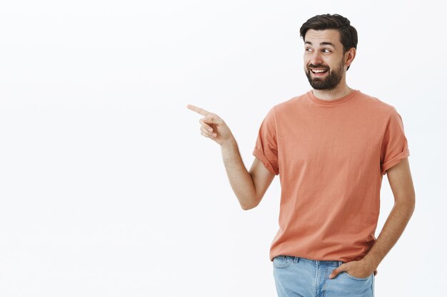 Expressive bearded man in orange Tshirt