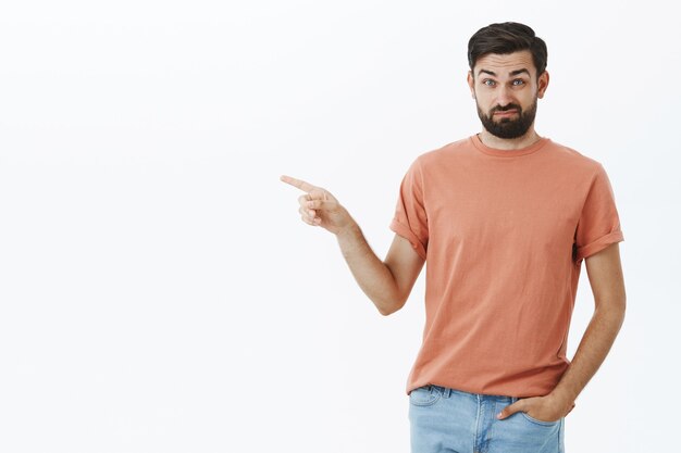 Expressive bearded man in orange Tshirt