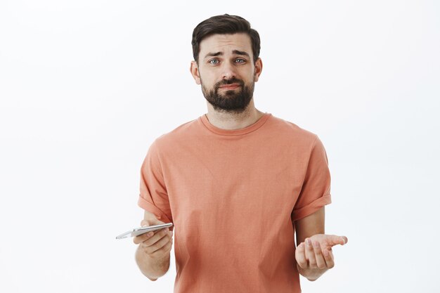 Expressive bearded man in orange Tshirt