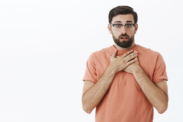 Expressive bearded man in orange Tshirt