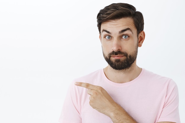 Expressive bearded man in pink Tshirt