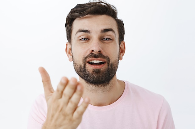 Expressive bearded man in pink Tshirt