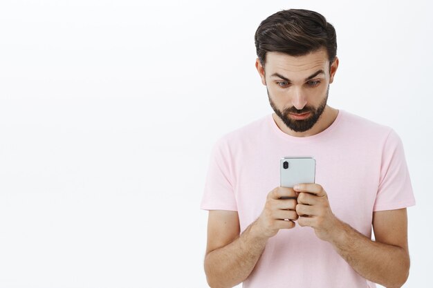 Expressive bearded man in pink Tshirt