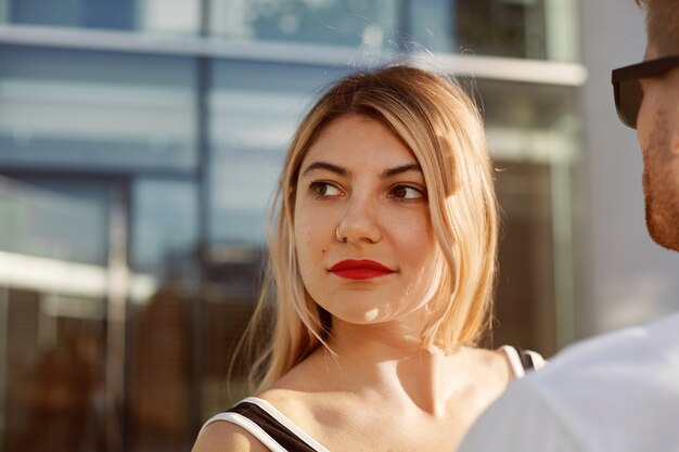 An expressive couple is posing outdoor