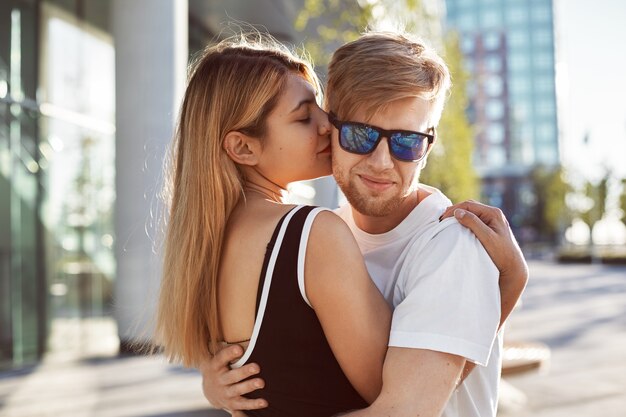 An expressive couple is posing outdoor