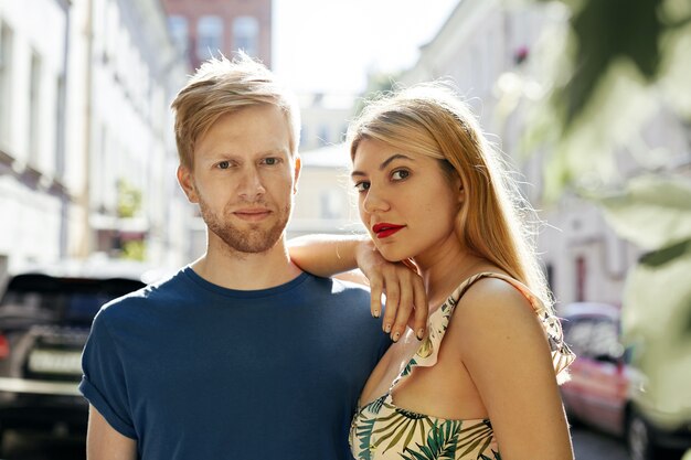 Expressive couple posing in the city