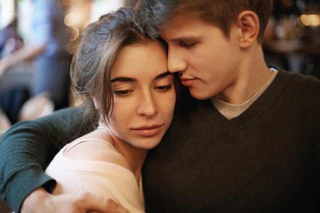 Expressive couple posing indoor