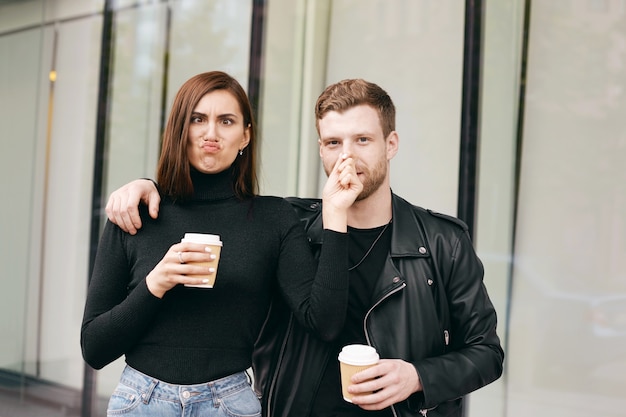 Expressive couple posing outdoor