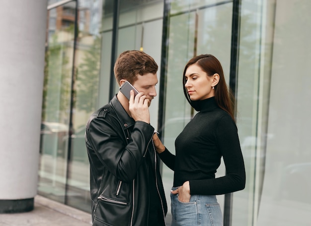 Expressive couple posing outdoor