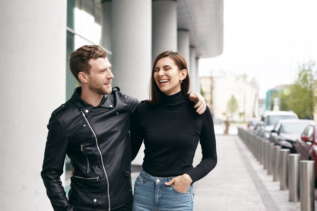 Expressive couple posing outdoor