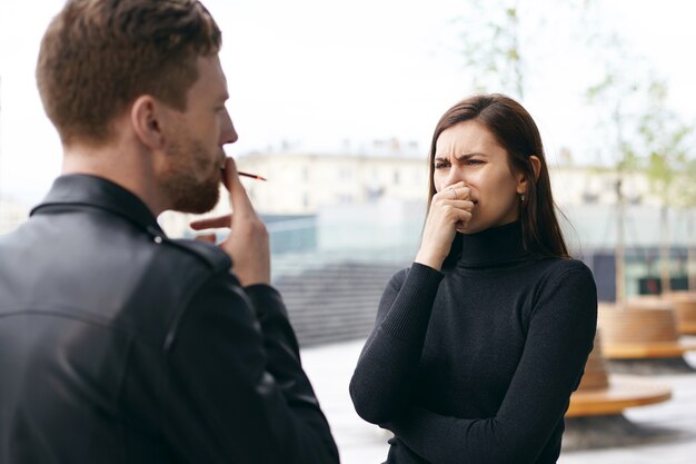 Expressive couple posing outdoor