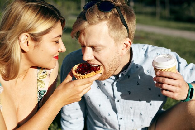 Expressive couple posing in the park