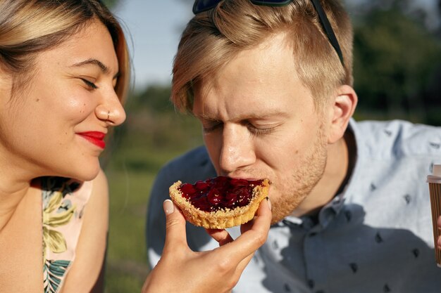 Expressive couple posing in the park