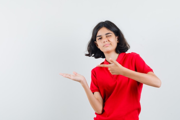 An expressive girl is posing in the studio