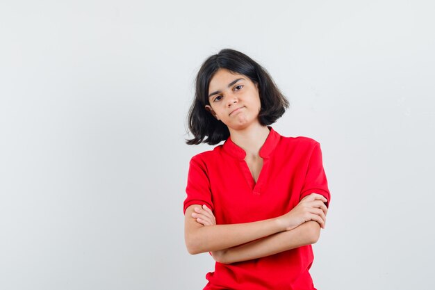 An expressive girl is posing in the studio