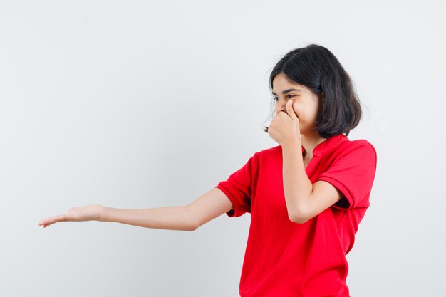 An expressive girl is posing in the studio