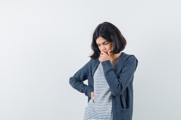 An expressive girl is posing in the studio