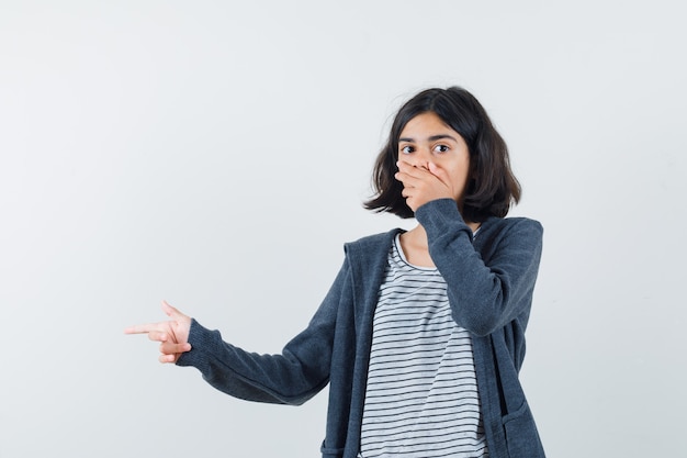 An expressive girl is posing in the studio