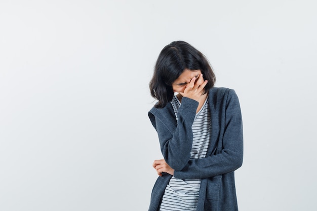 An expressive girl is posing in the studio