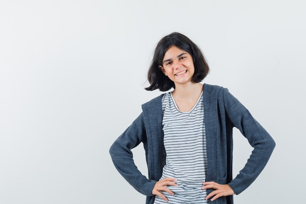 An expressive girl is posing in the studio