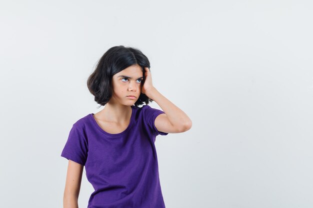 An expressive girl is posing in the studio