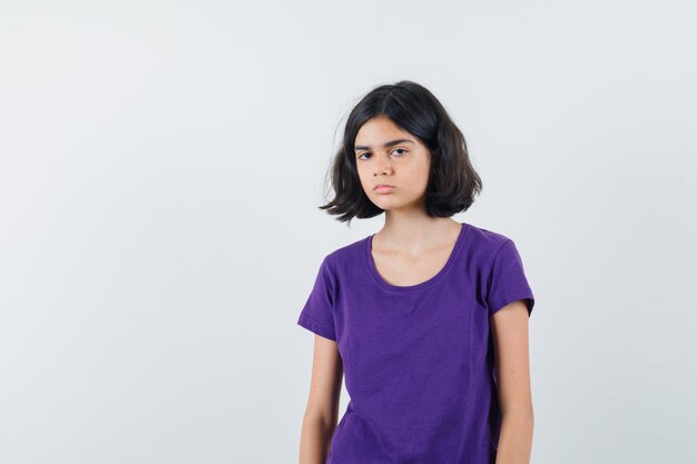 An expressive girl is posing in the studio