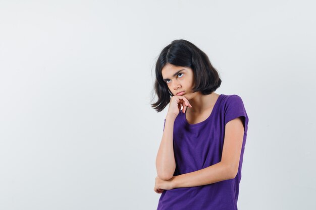 An expressive girl is posing in the studio