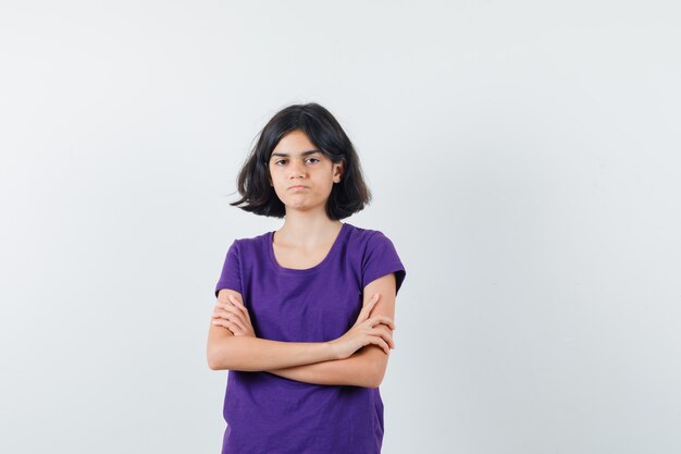 An expressive girl is posing in the studio