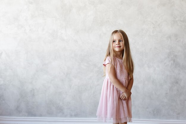 Expressive kid is posing in the house