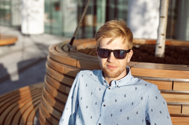 Expressive man is posing in the park