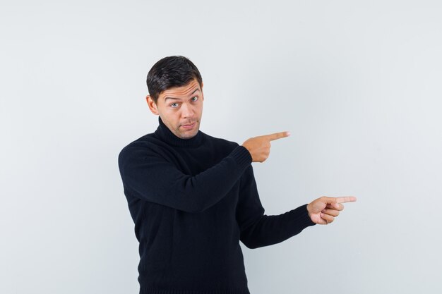 An expressive man is posing in the studio