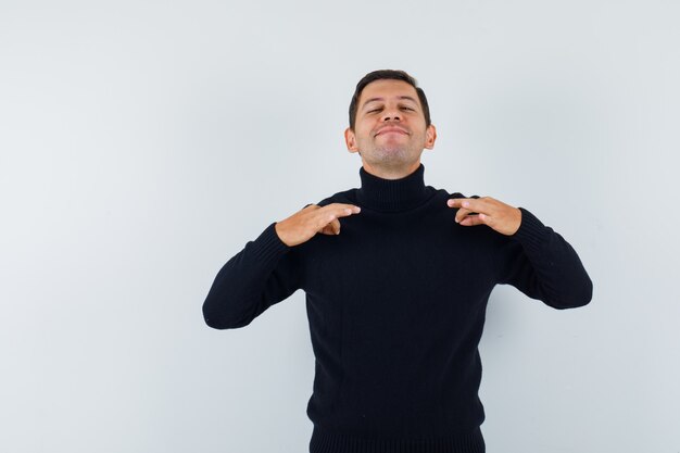 An expressive man is posing in the studio