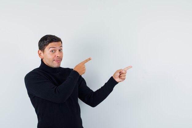 An expressive man is posing in the studio