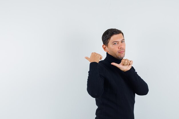 An expressive man is posing in the studio