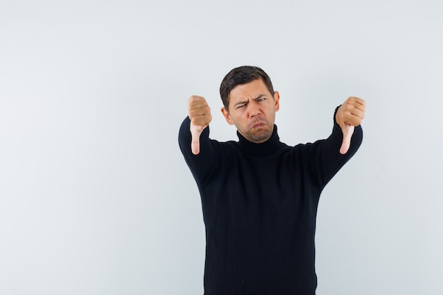 An expressive man is posing in the studio